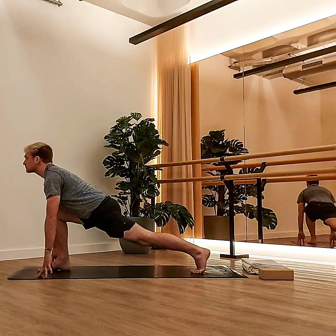 Man in low lunge Yoga pose